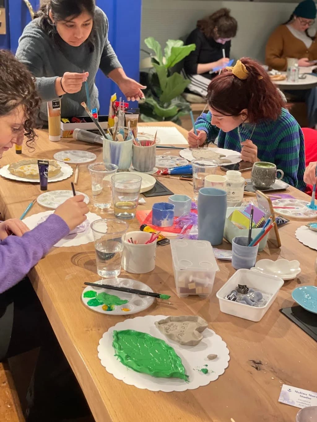 Ceramics workshop at Barcine – participants painting