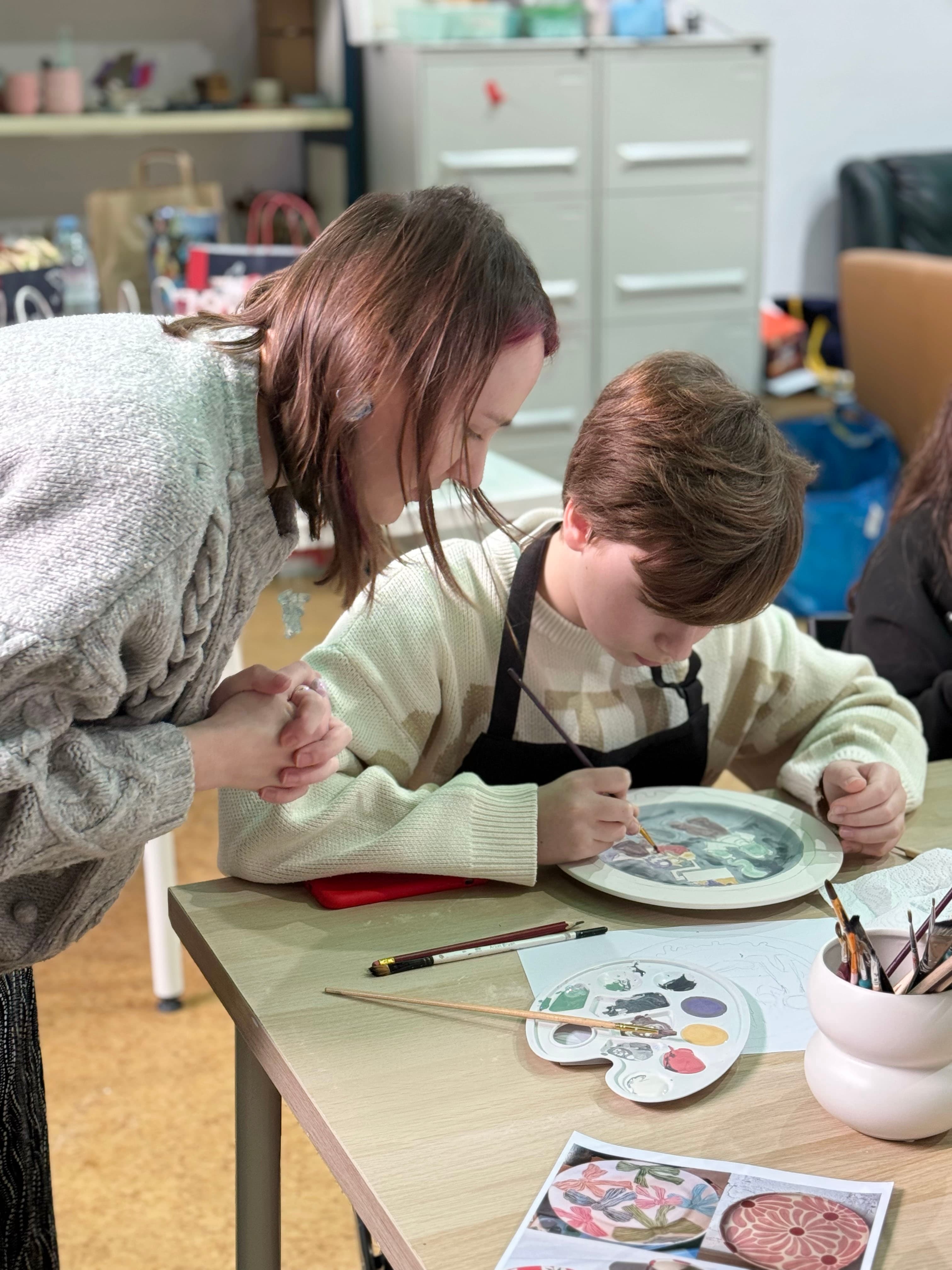 Kids making ceramics at a birthday party