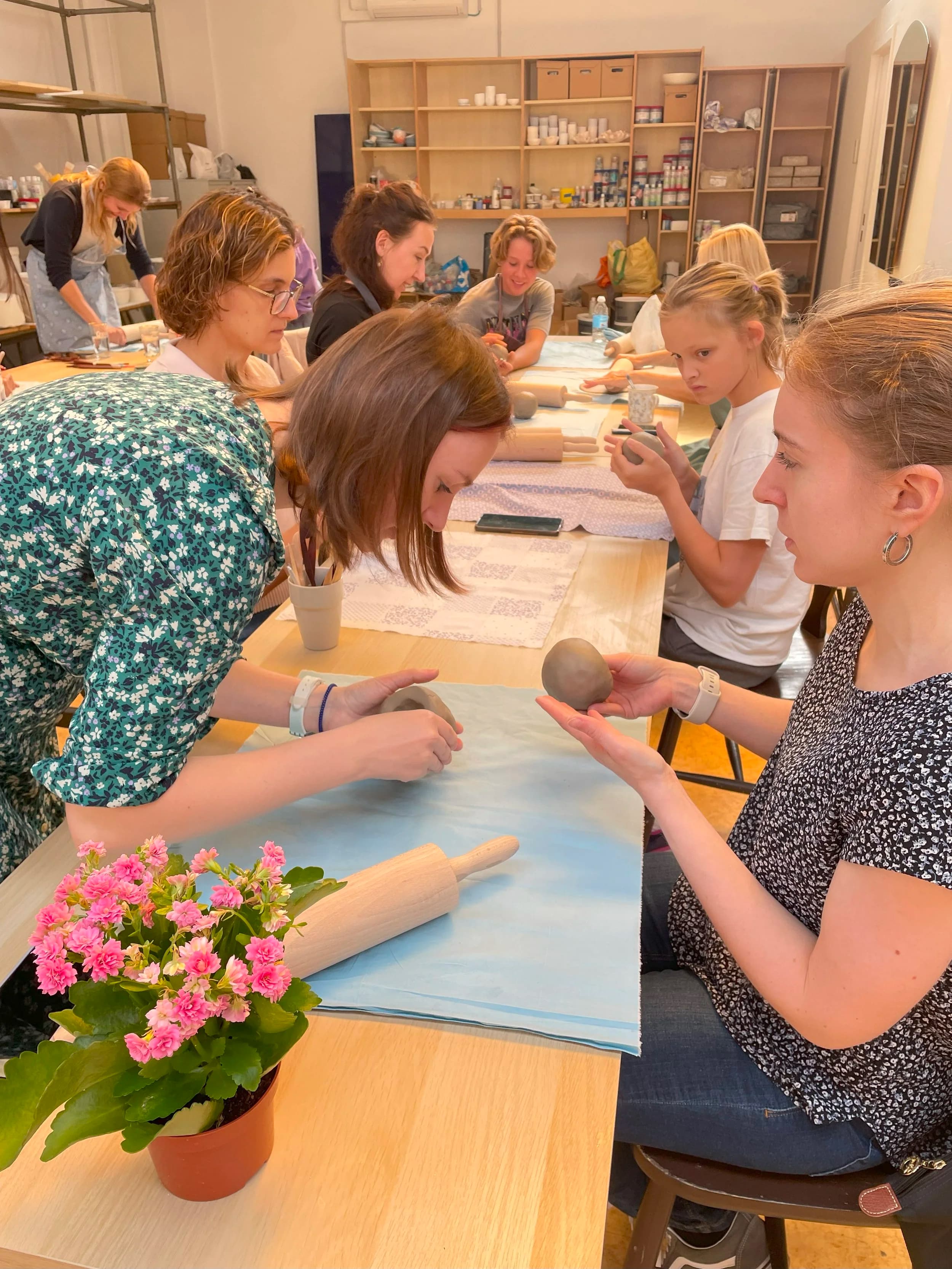 Group pottery workshop with teacher and students